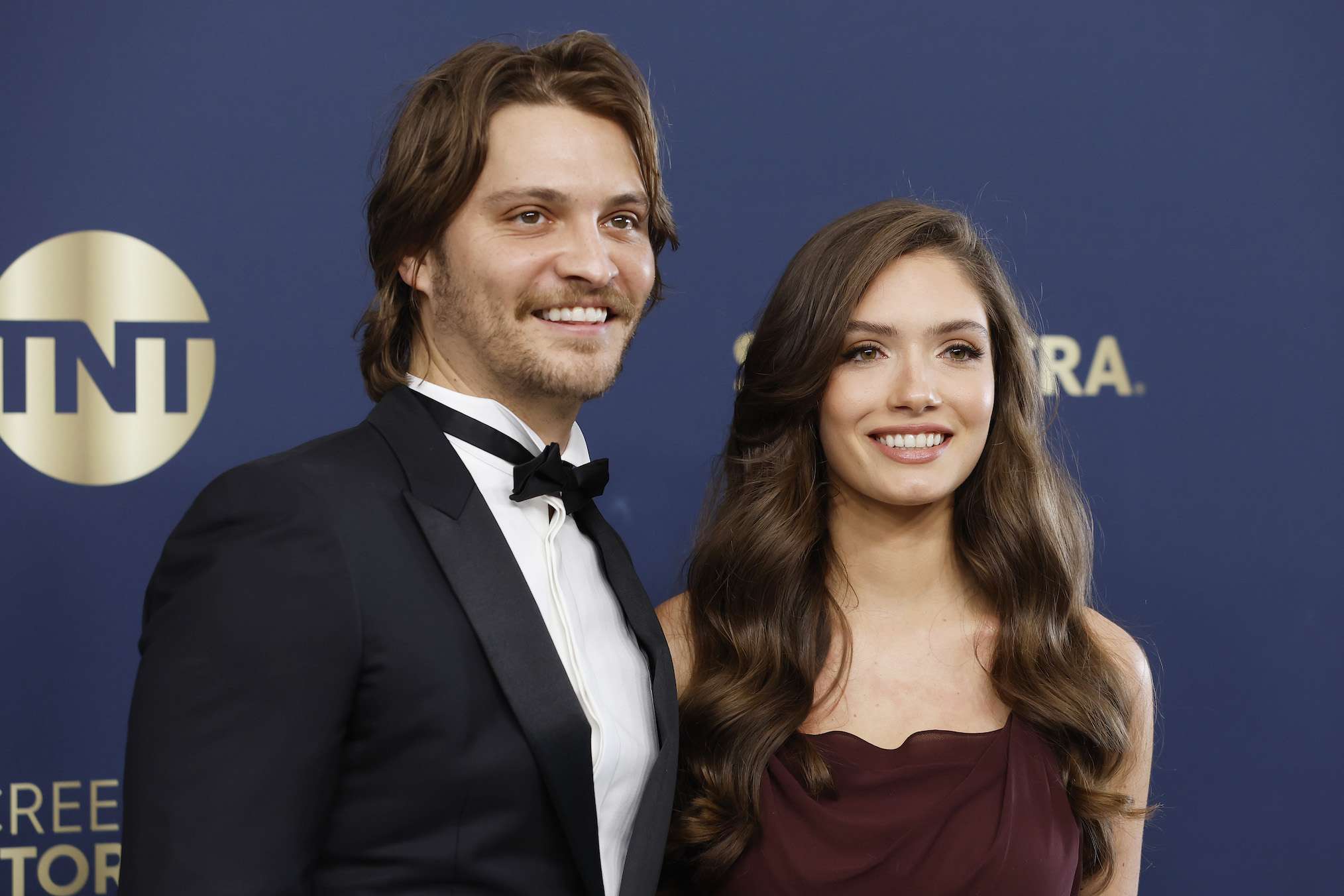 Luke Grimes and Bianca Rodrigues attend the 28th Annual Screen Actors Guild Awards at Barker Hangar on February 27, 2022 in Santa Monica, California.